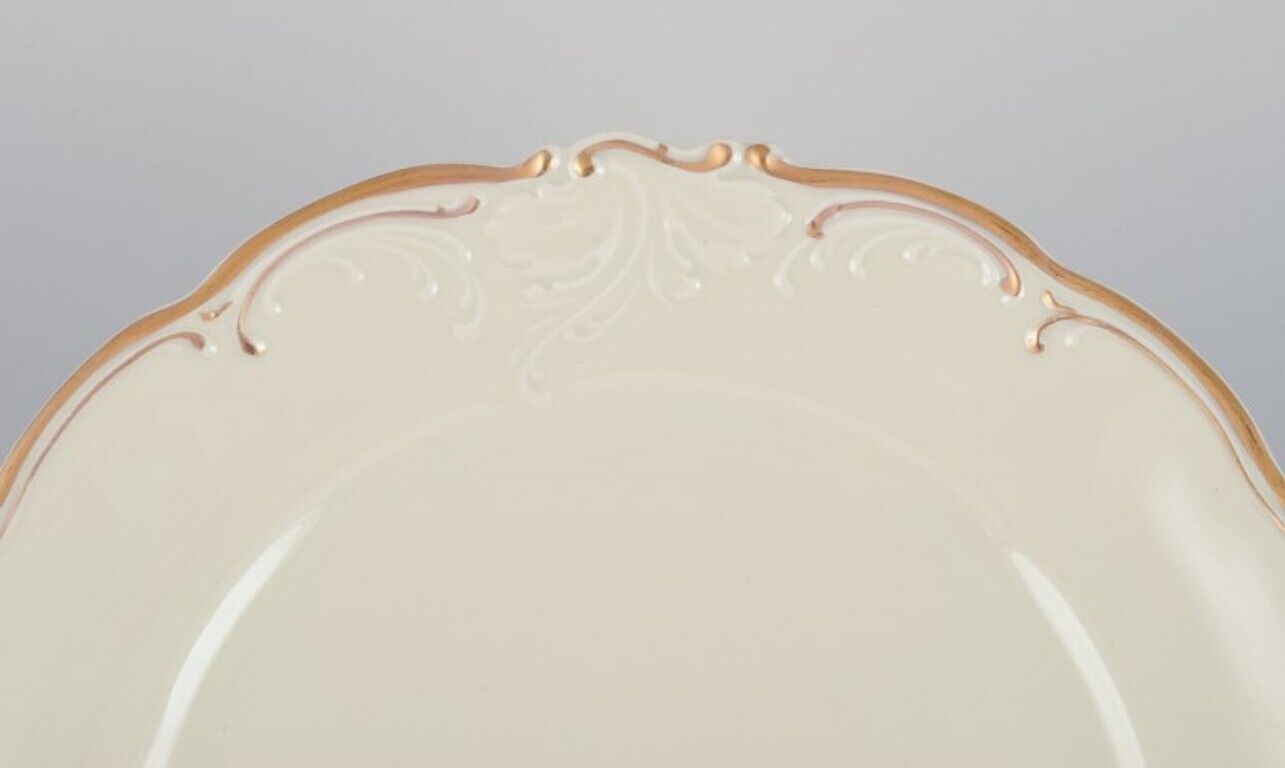 KPM Poland A set of five dinner plates in cream-colored porcelain