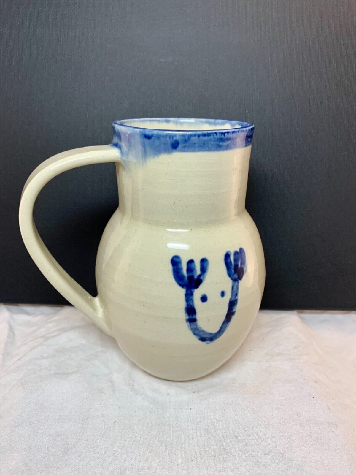 Studio pottery white jug vase with cobalt blue reindeer sketch signed 16x13cm