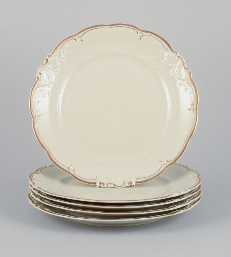 KPM Poland A set of five dinner plates in cream-colored porcelain