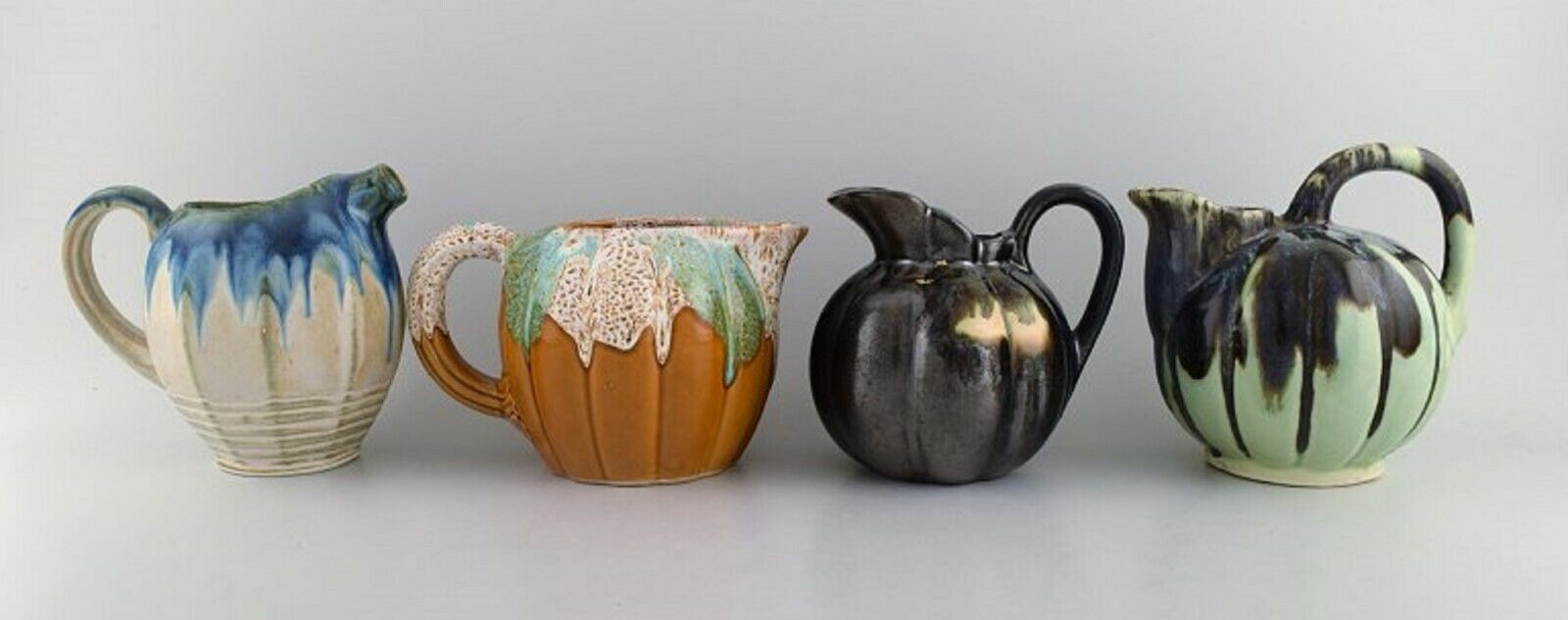 Four retro jugs in glazed ceramics Beautiful glazes and shapes Belgium 1960s