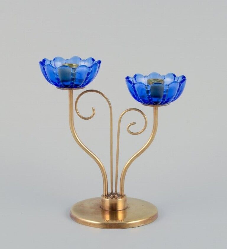 Gunnar Ander for Ystad Metall Brass candlestick holder with blue glass sleeves