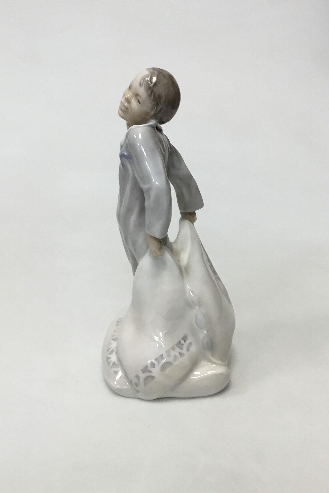 Royal Copenhagen Figurine of Boy with pillows No 2604