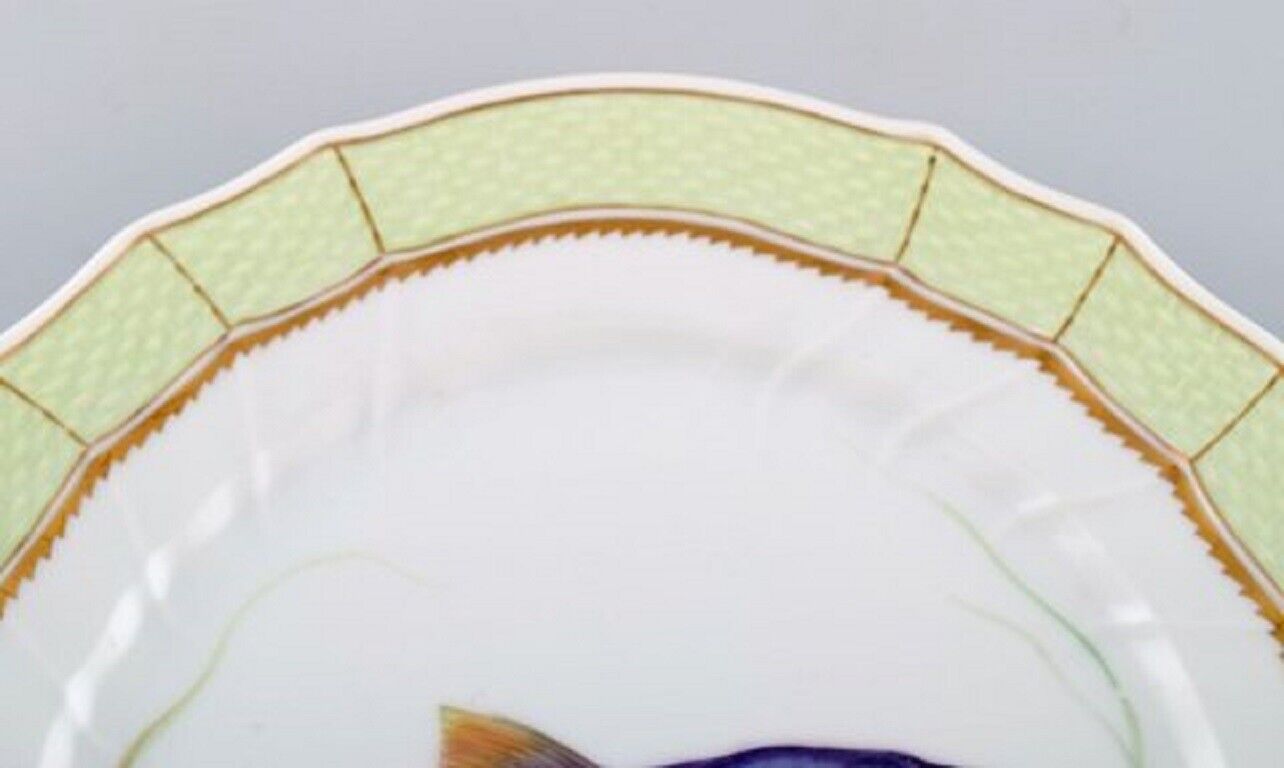 Royal Copenhagen fish plate with green edge gold decoration and fish motif