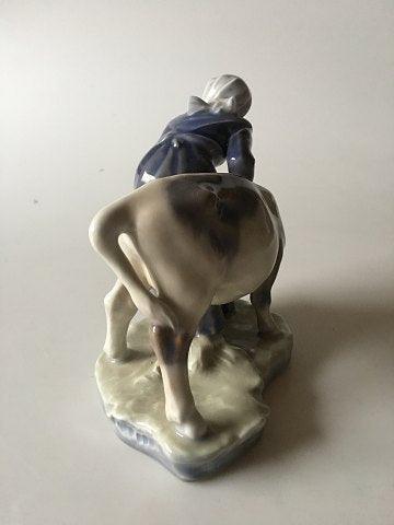 Royal Copenhagen Figurine Girl with Calf No 779