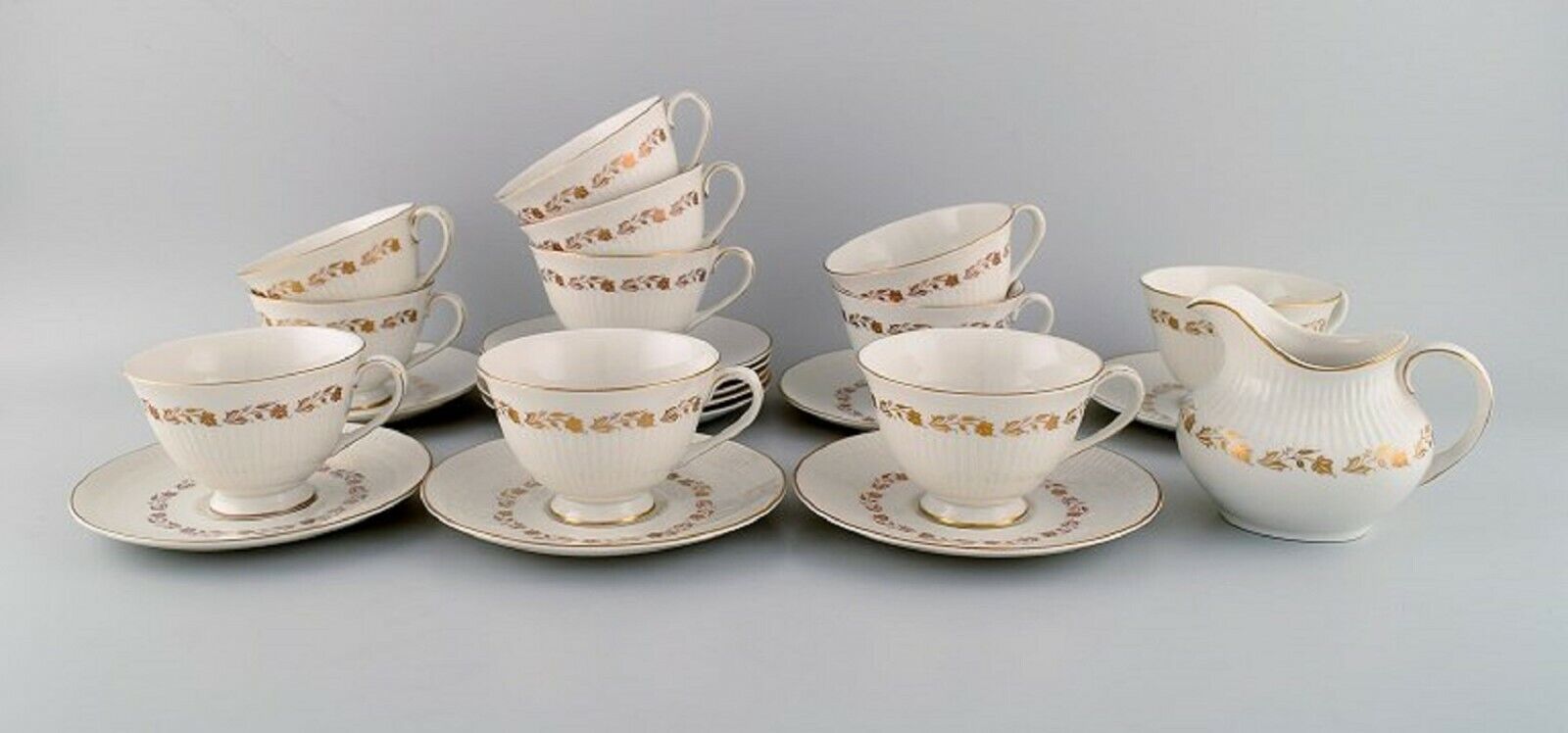 Royal Doulton England Twelve Fairfax teacups with saucers and a cream jug