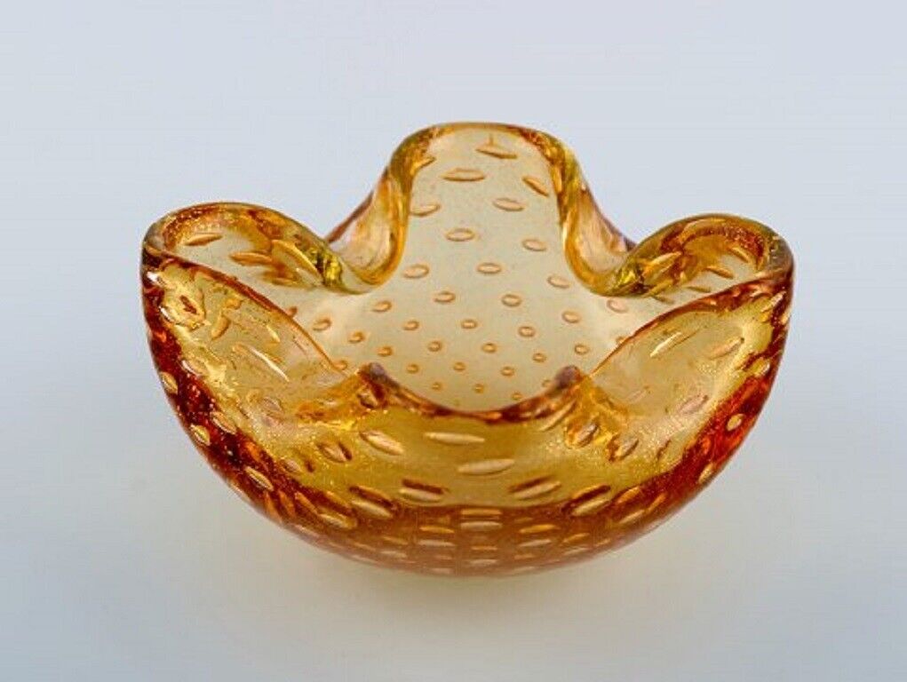 Murano bowl in amber colored mouth-blown art glass with inlaid air bubbles