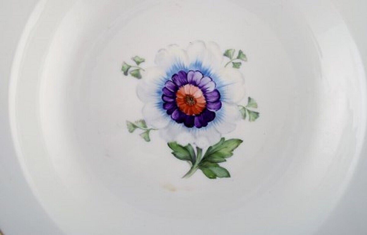 Four antique Royal Copenhagen deep plates in hand-painted porcelain