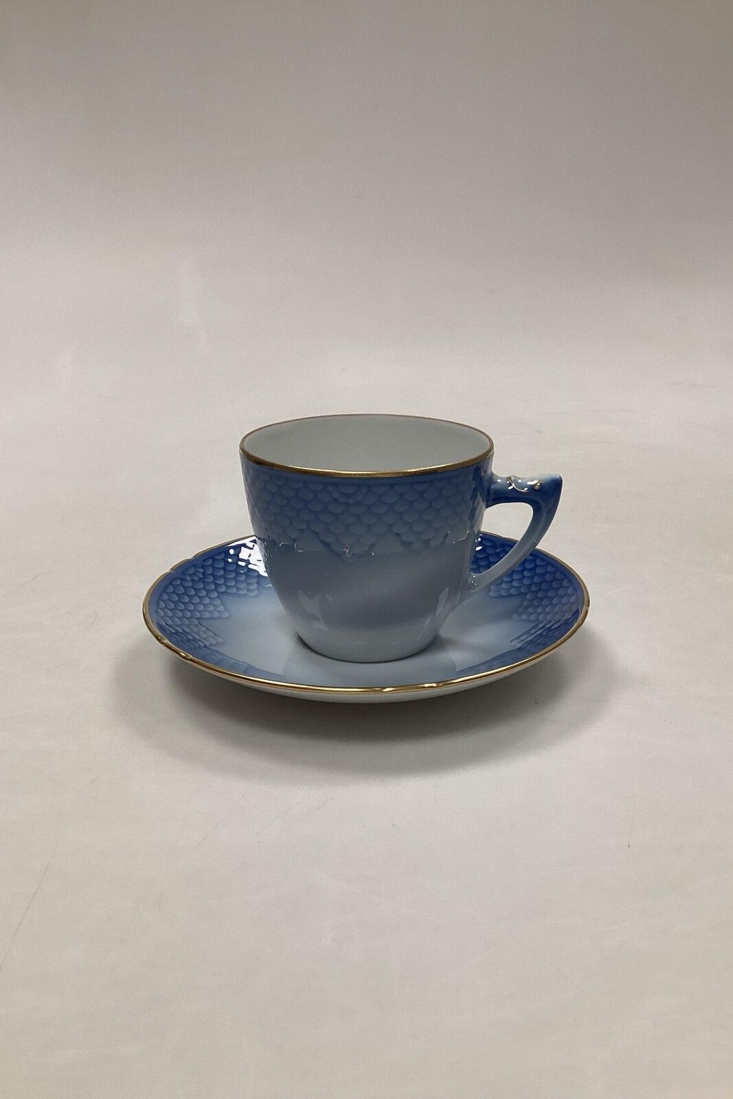 Royal Copenhagen / Bing Grondahl Blue Tone with gold Coffee cup and saucer No RC