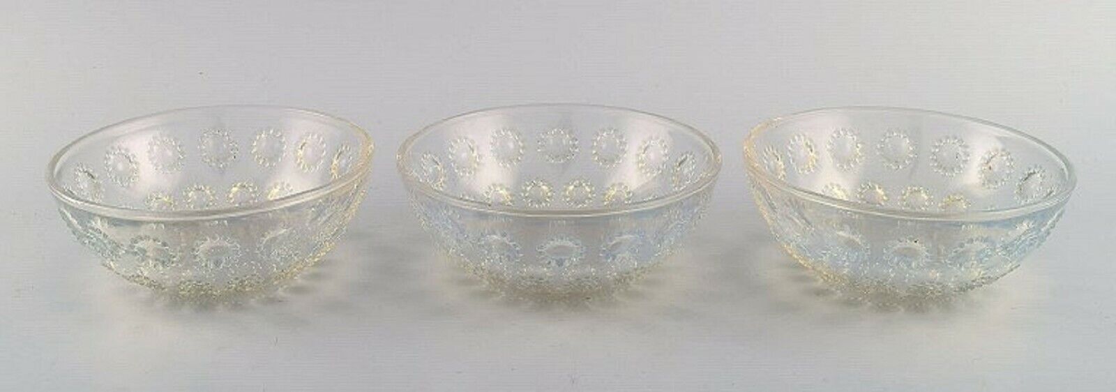 Three early René Lalique "Asters" bowls in art glass Dated before 1945