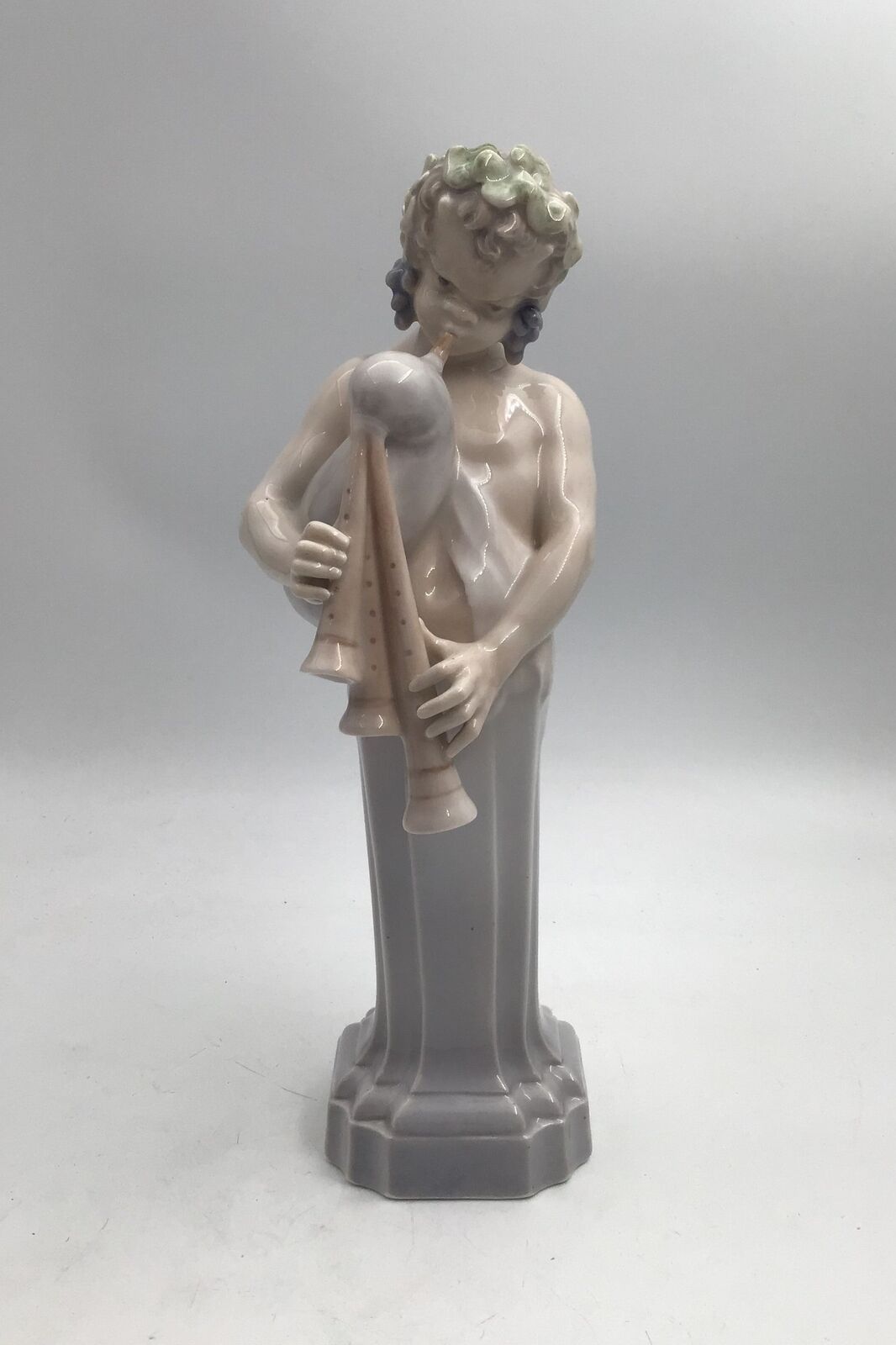 Royal Copenhagen Figurine Dionysus / Bacchus with bagpipe No 2071