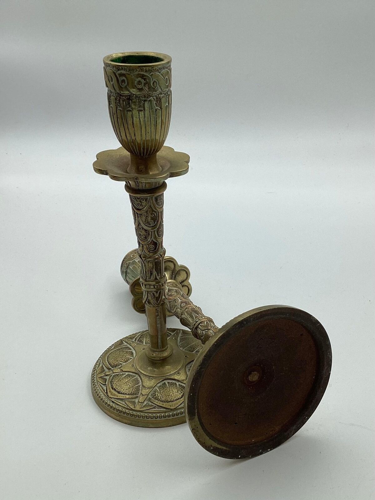 Pair of brass candlesticks with art deco decorations in relief ca 1920