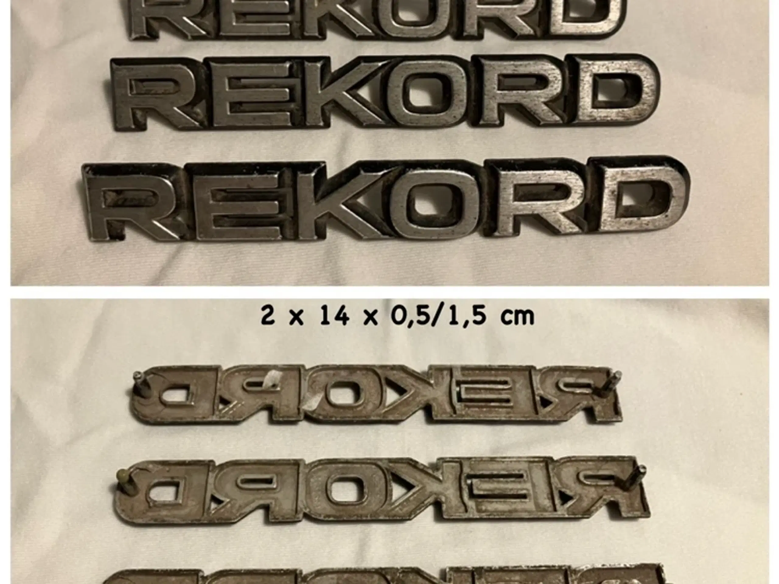 Opel Rekord og Toyota Corona emblemer