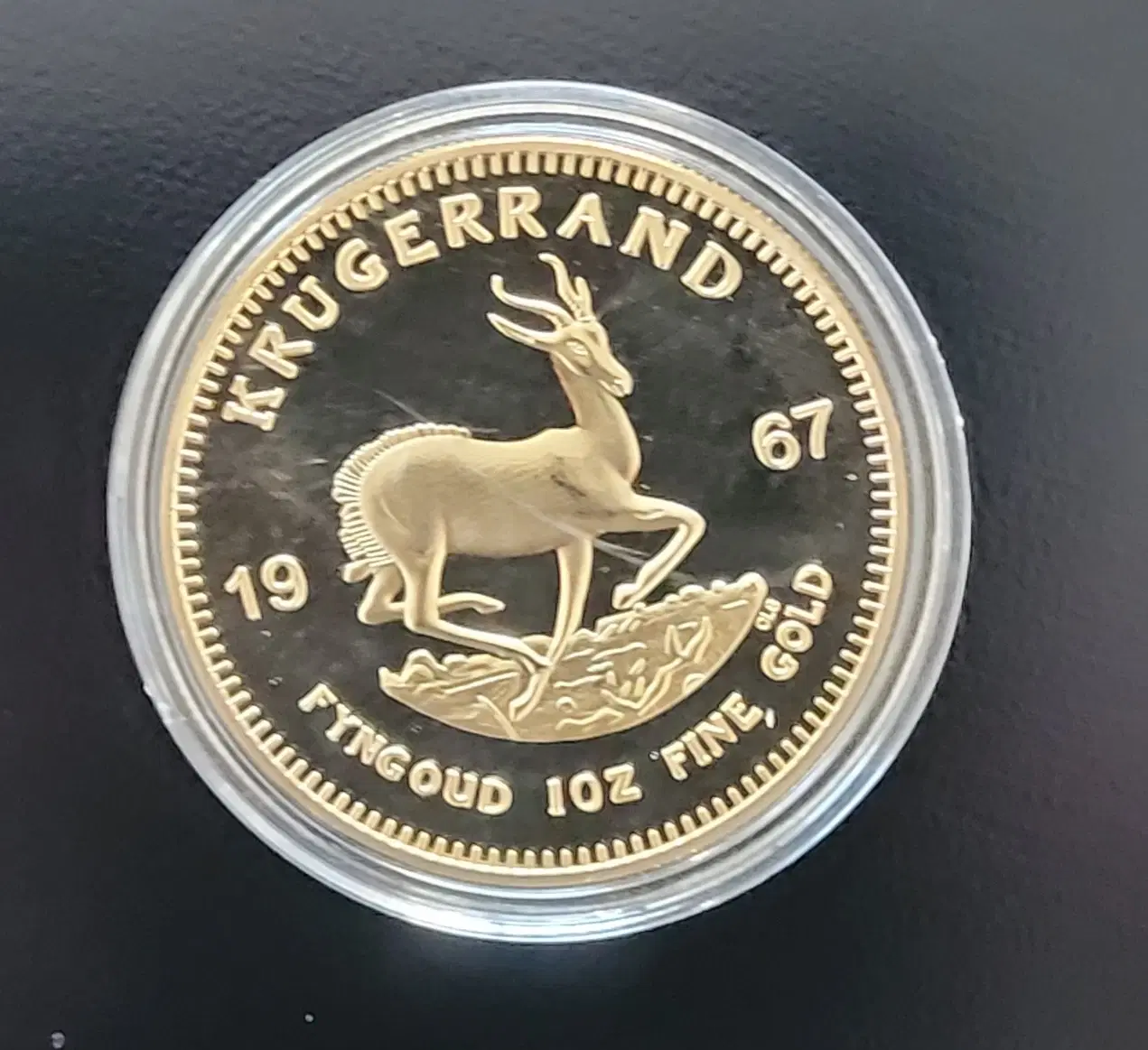 Krugerrand medalje i uædelt metal i bordholder