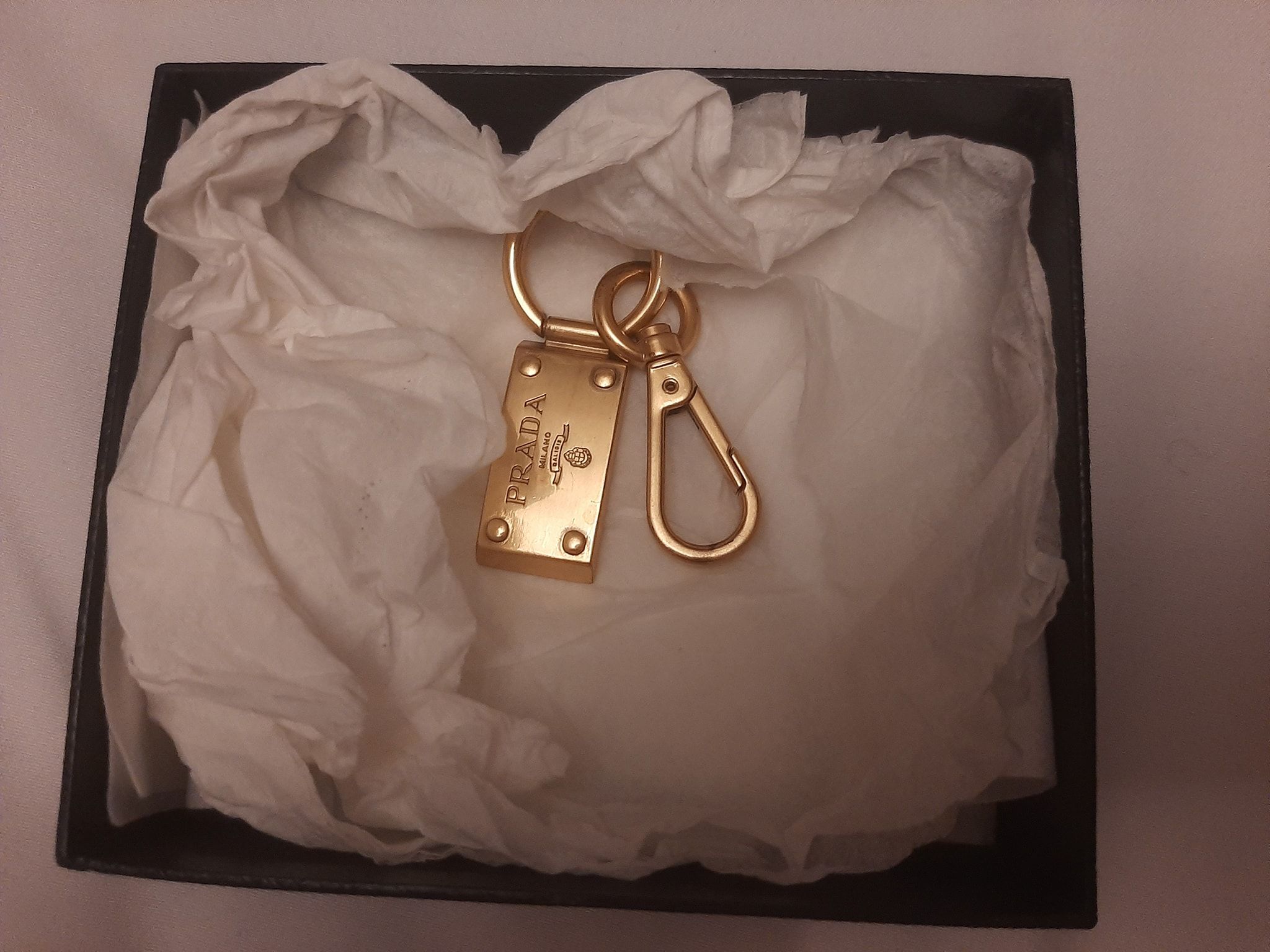 Prada Gold-tone metal logo charm keyring gold