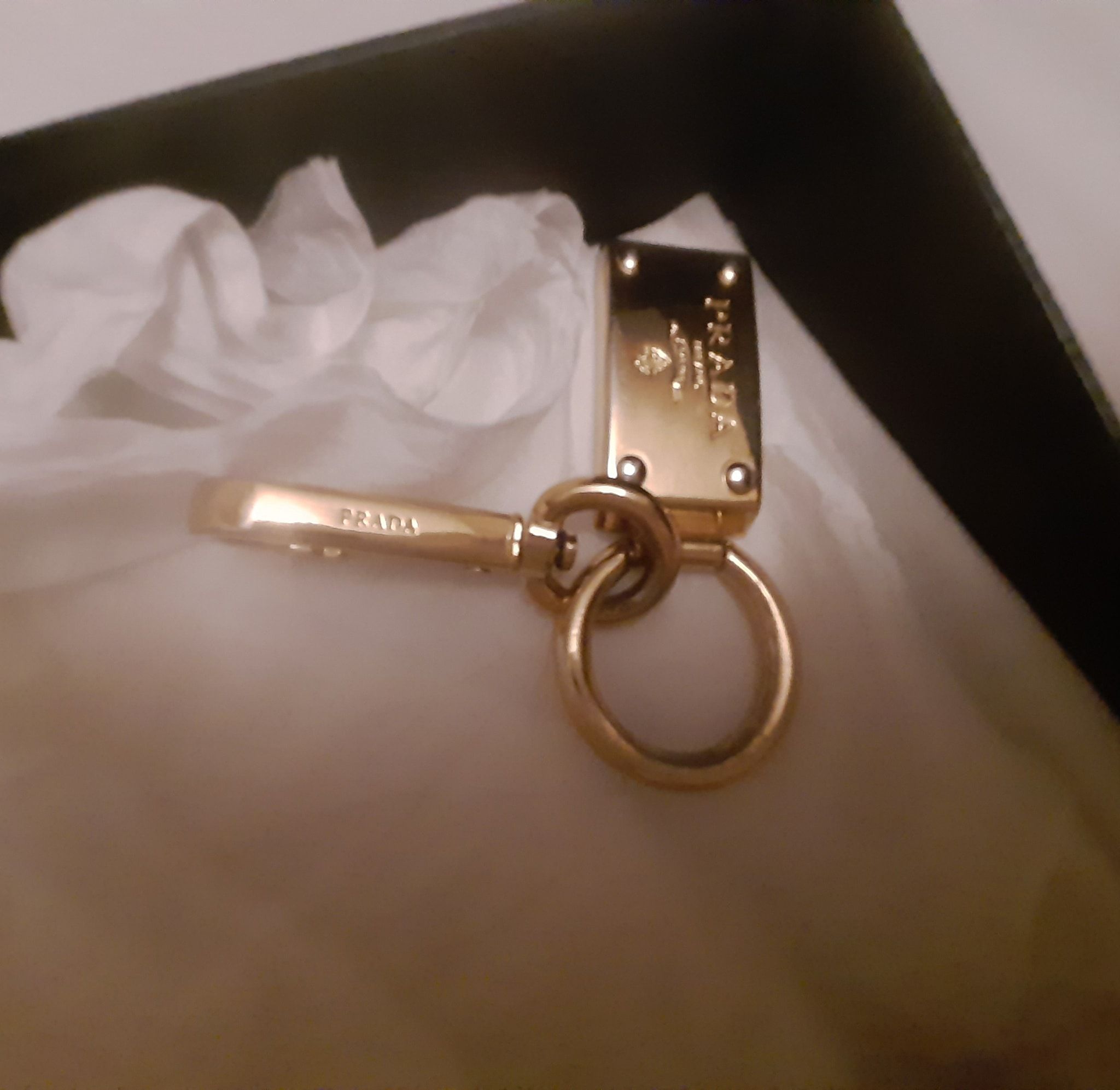 Prada Gold-tone metal logo charm keyring gold