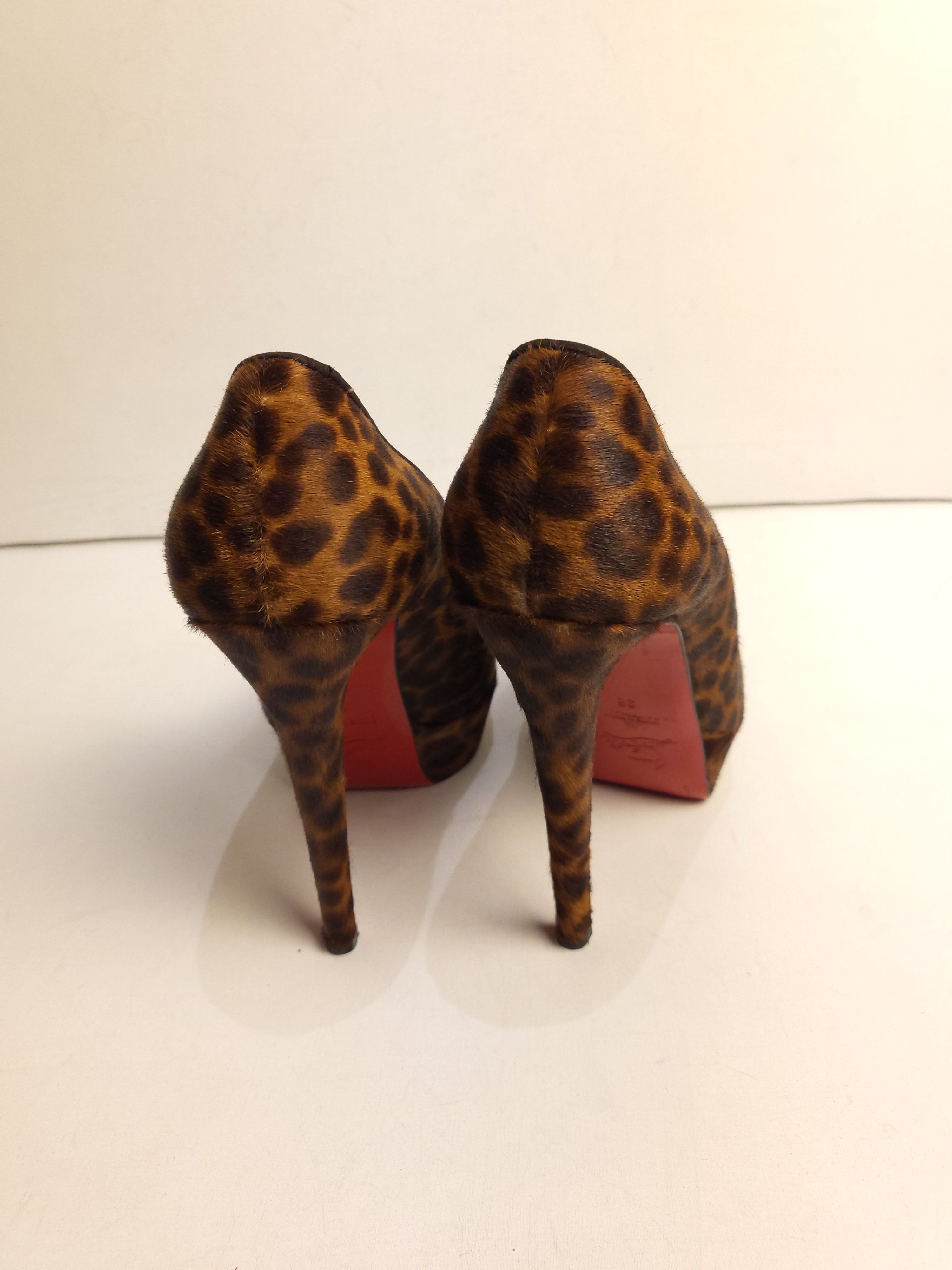 Preowned Christian Louboutin leopard print pony hair heeled pumps Size 38 Brown eel