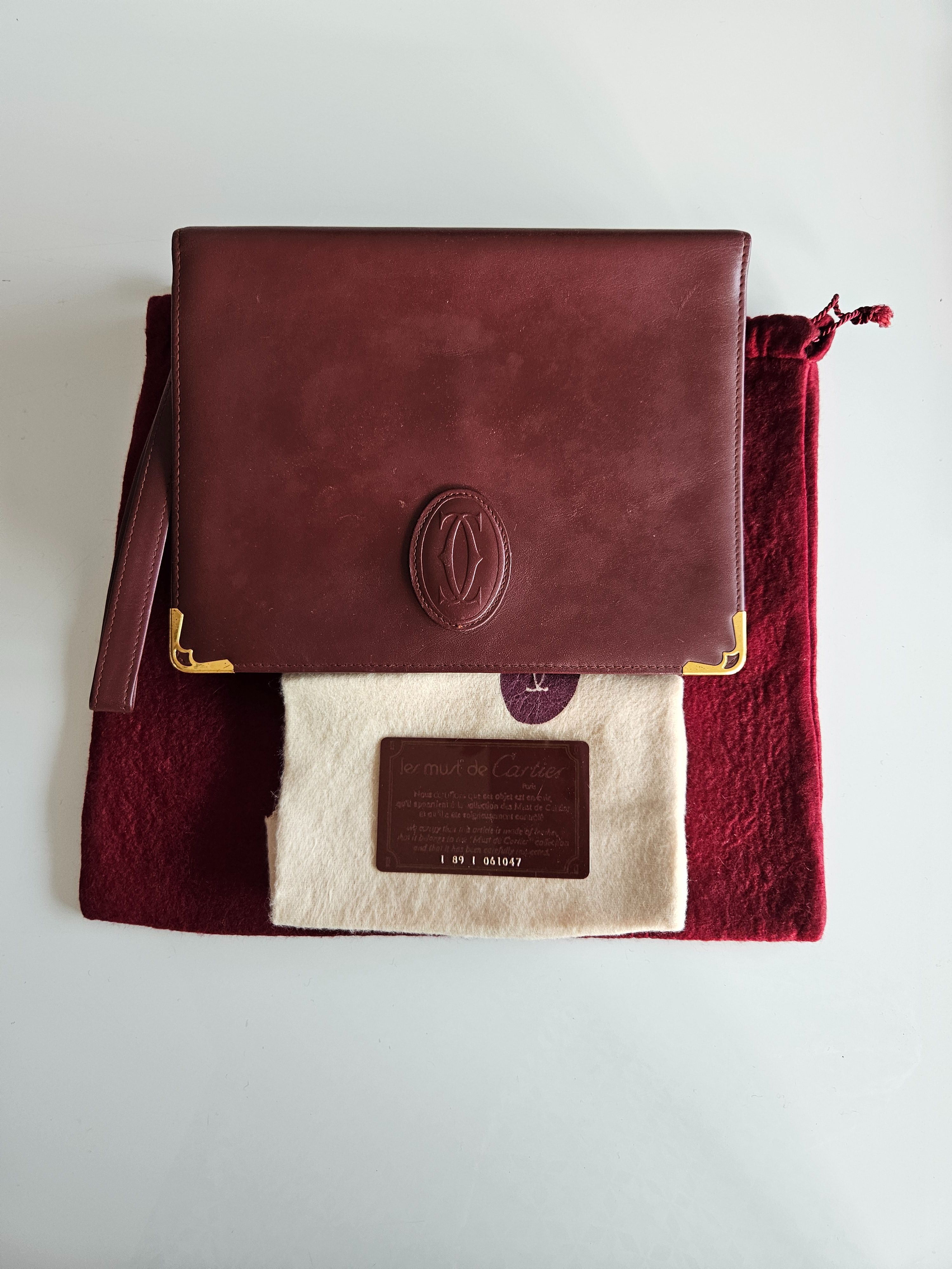 Preowned Cartier Bordeaux Leather Clutch Bag bordeaux and gold leather/ct gold-plated hardware