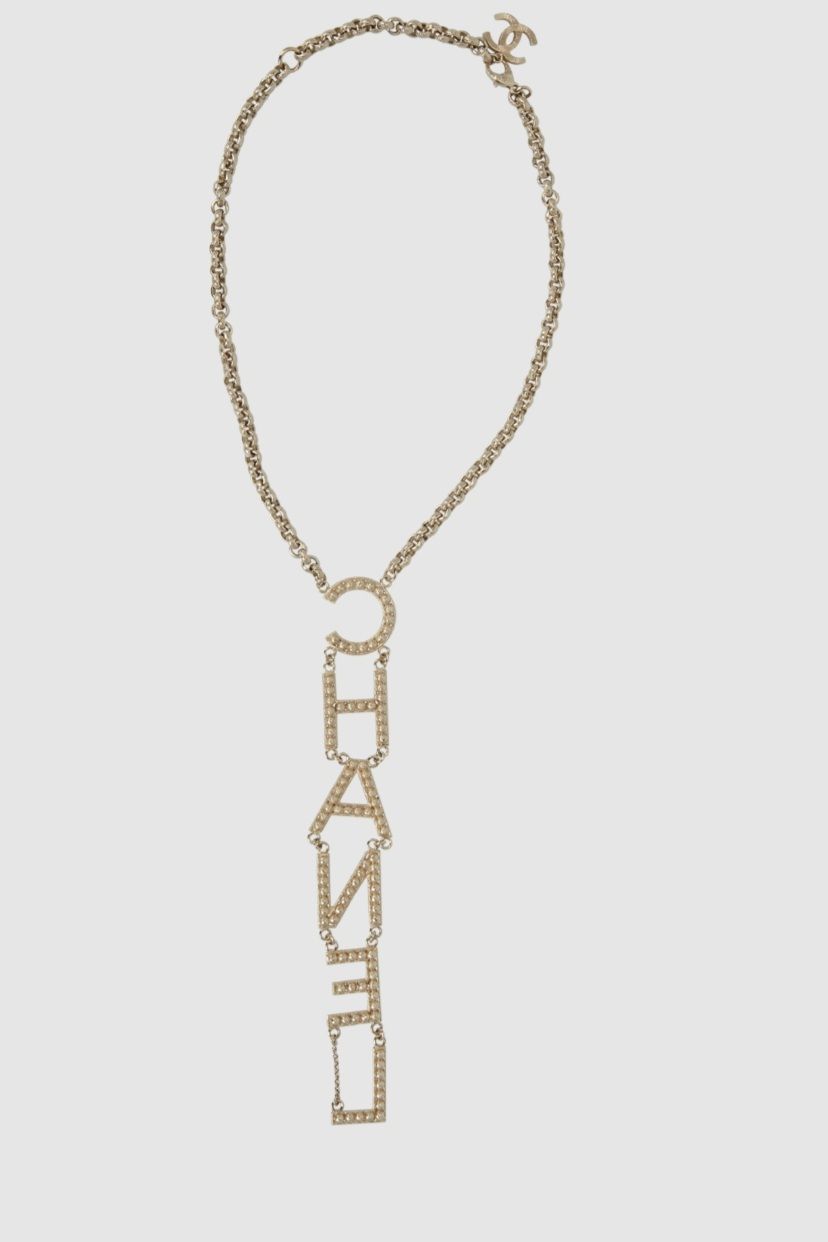 Preowned Chanel Champagne Gold Crystal Logo Necklace brass