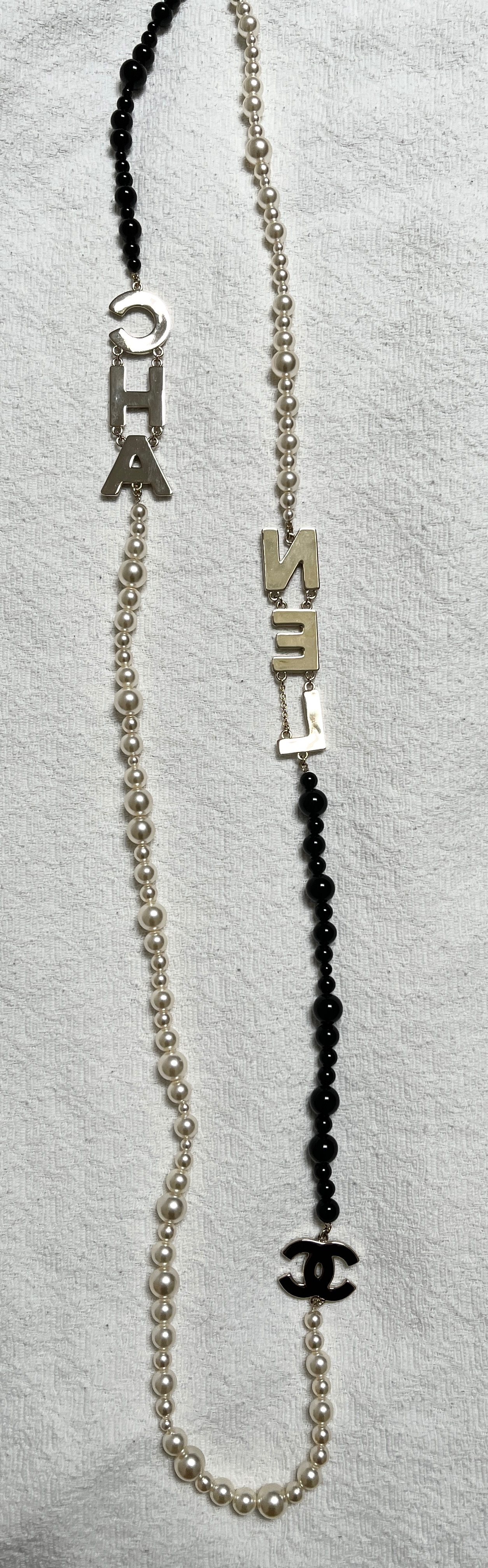 Preowned Faux Pearl CHANEL Letter Necklace Black white glass pearls/black beads