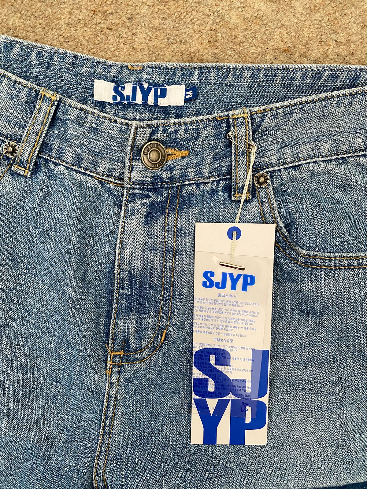 SJYP Mid-wash denim patchwork jeans Size M blue cotton