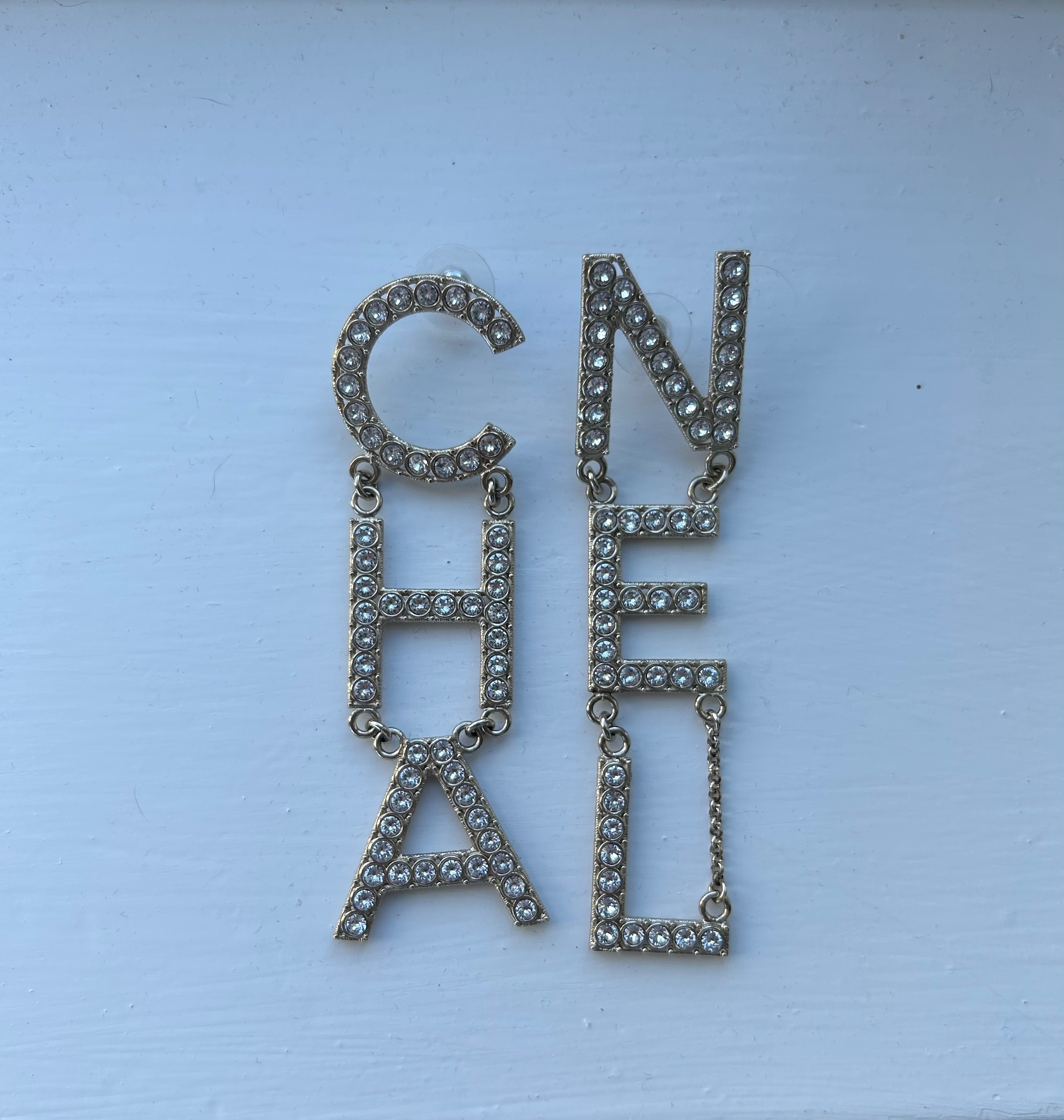 Chanel Gold Tone Crystal Embellished Logo Earrings Gold/ Silver metal