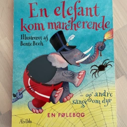 En elefant kom marcherende Bog