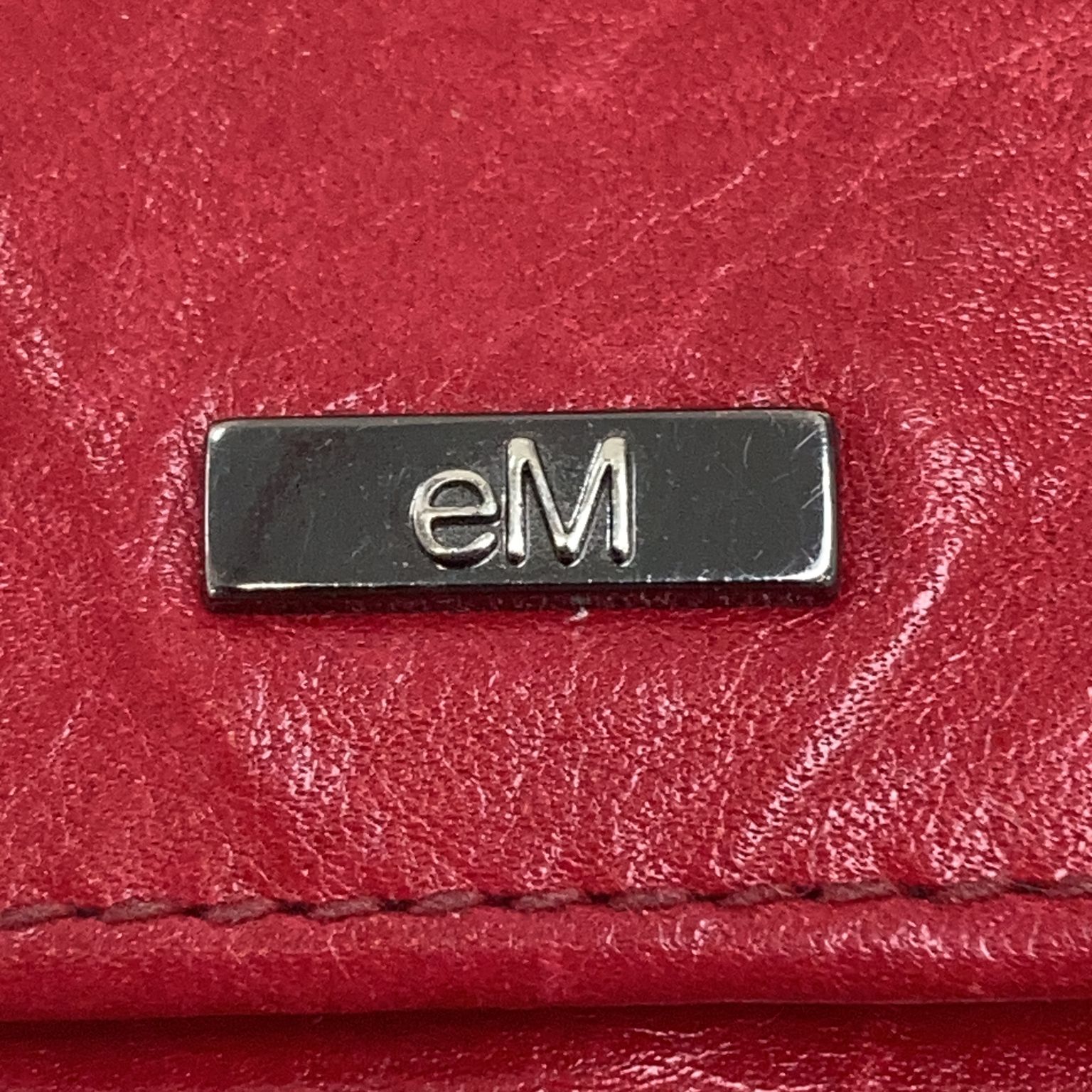 Em