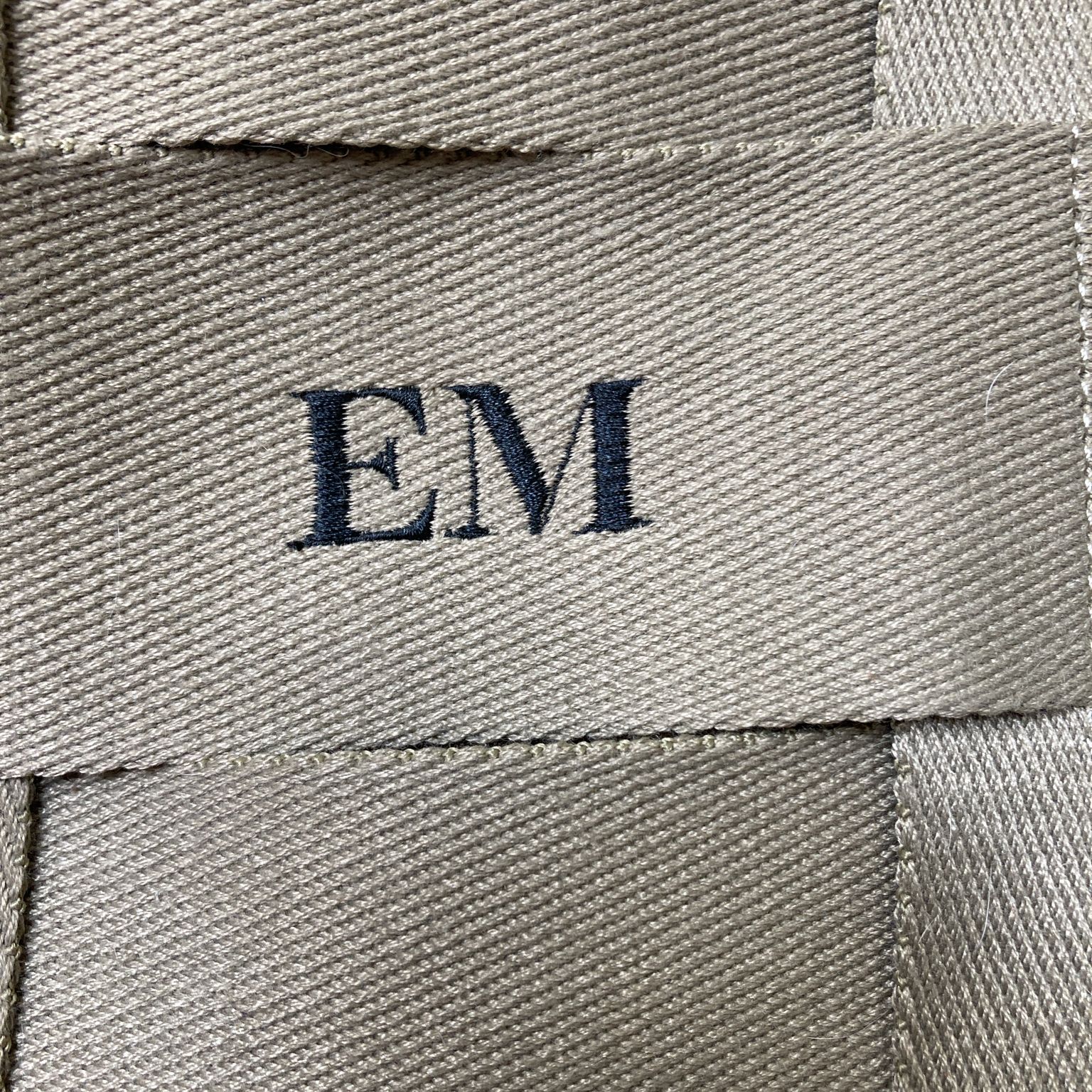 Em