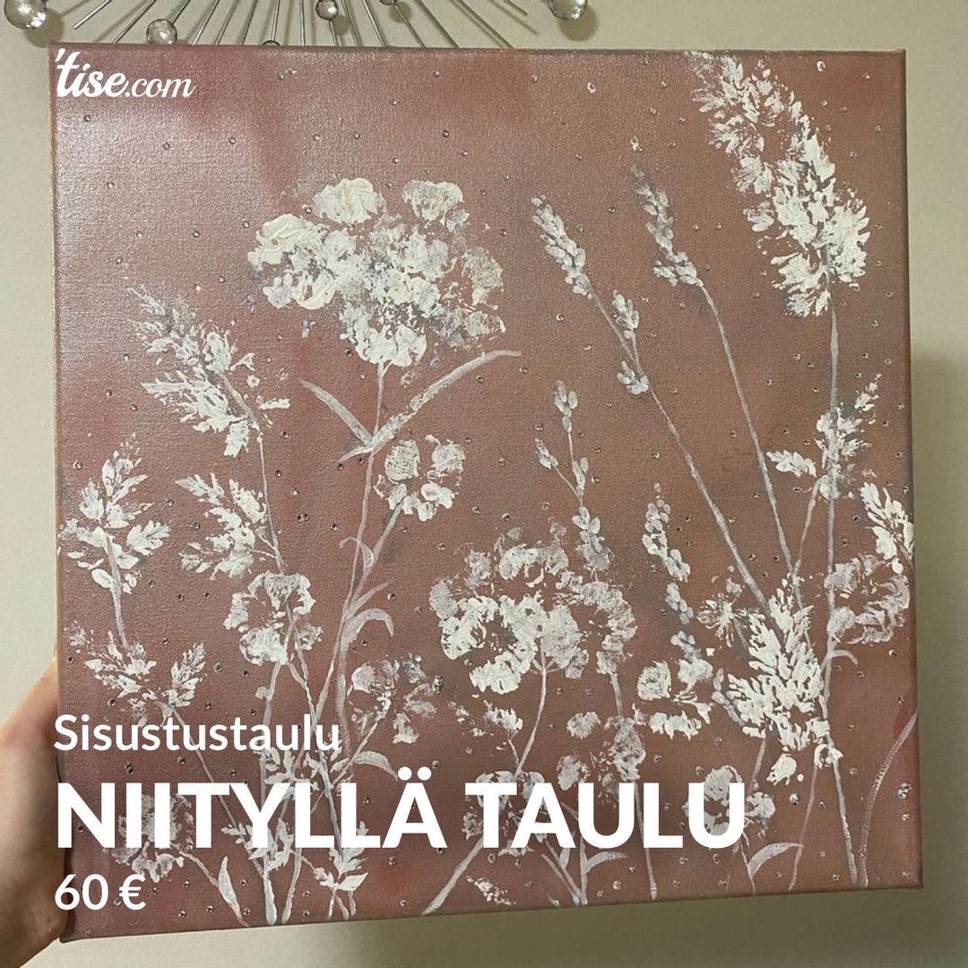 Niityllä taulu