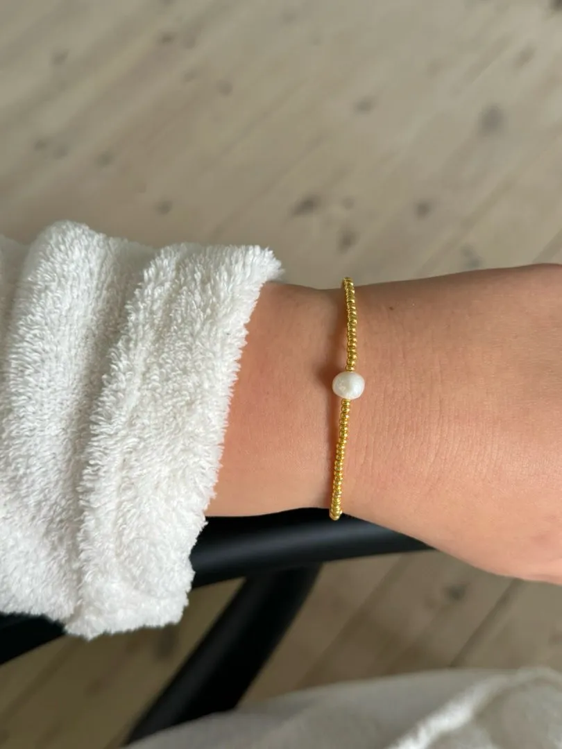 Guld armbånd