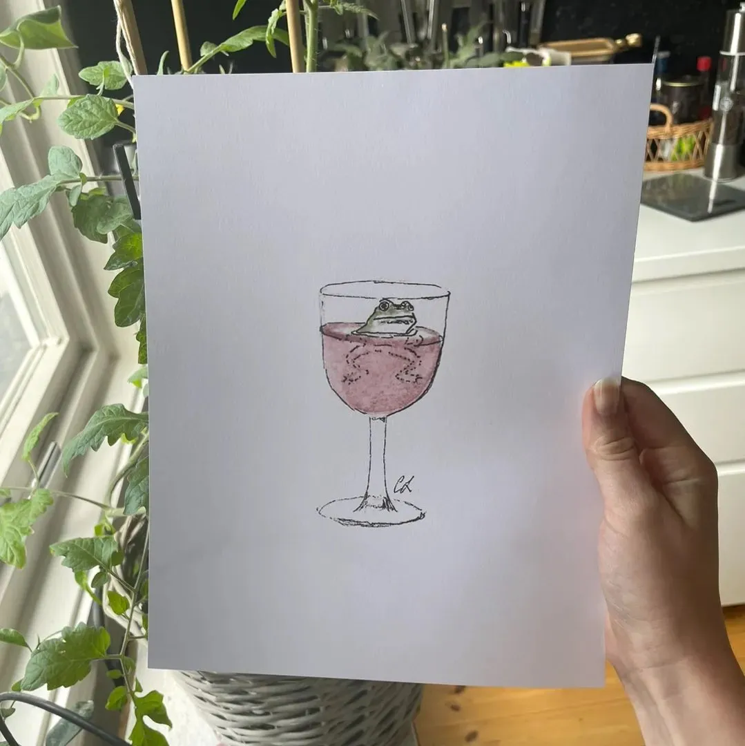 Frosk i et glass vin