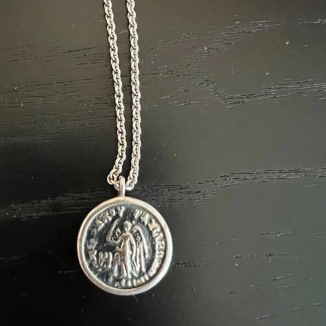 Coin pendant angel