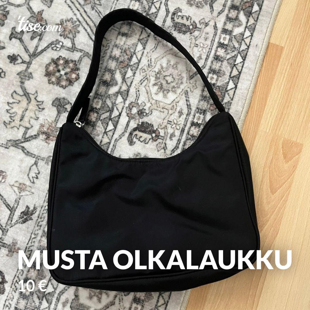 Musta olkalaukku