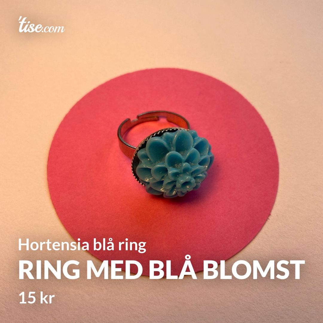 Ring med blå blomst