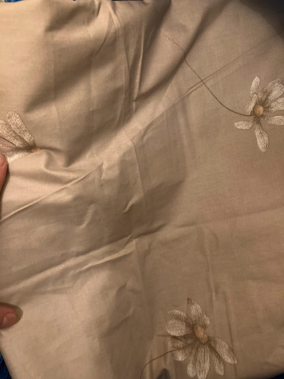 Beige flowery bed sheets