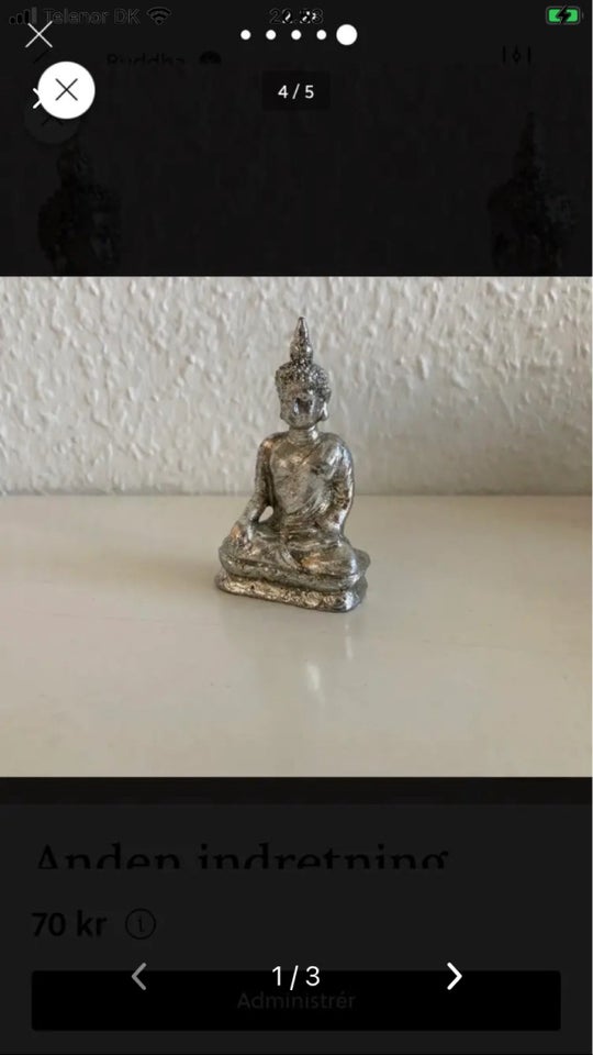 Sølvfarvet Buddha skulptur