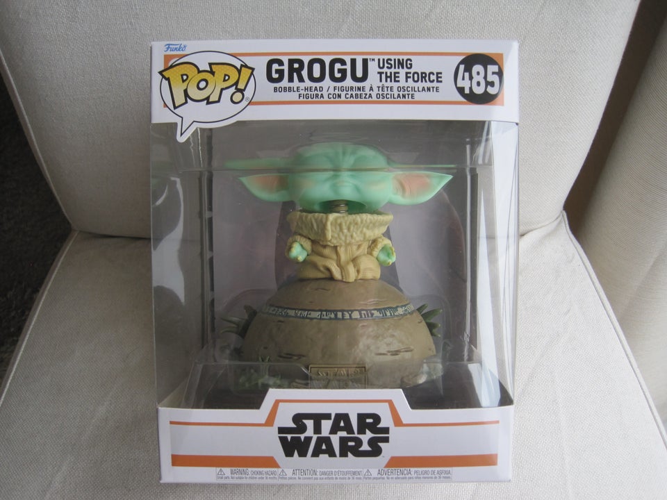 Funko Pop #485 Grogu using the