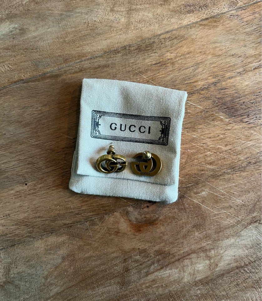 Ørestikker, Gucci