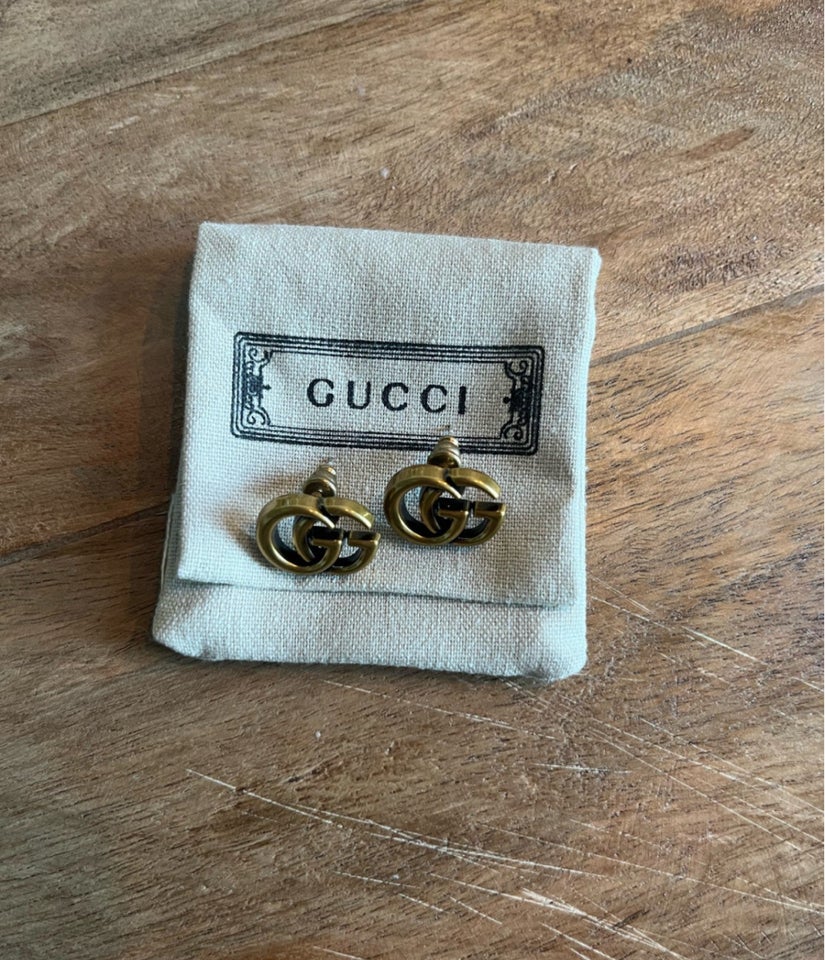 Ørestikker, Gucci