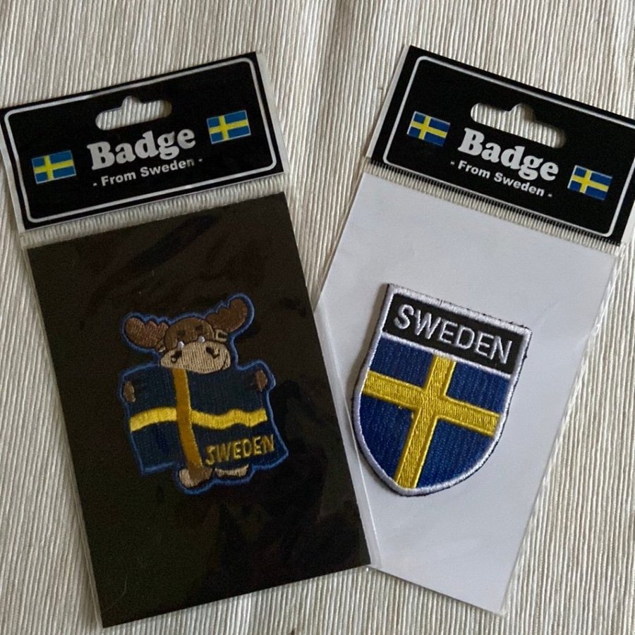 Badge, älg och vapensköld