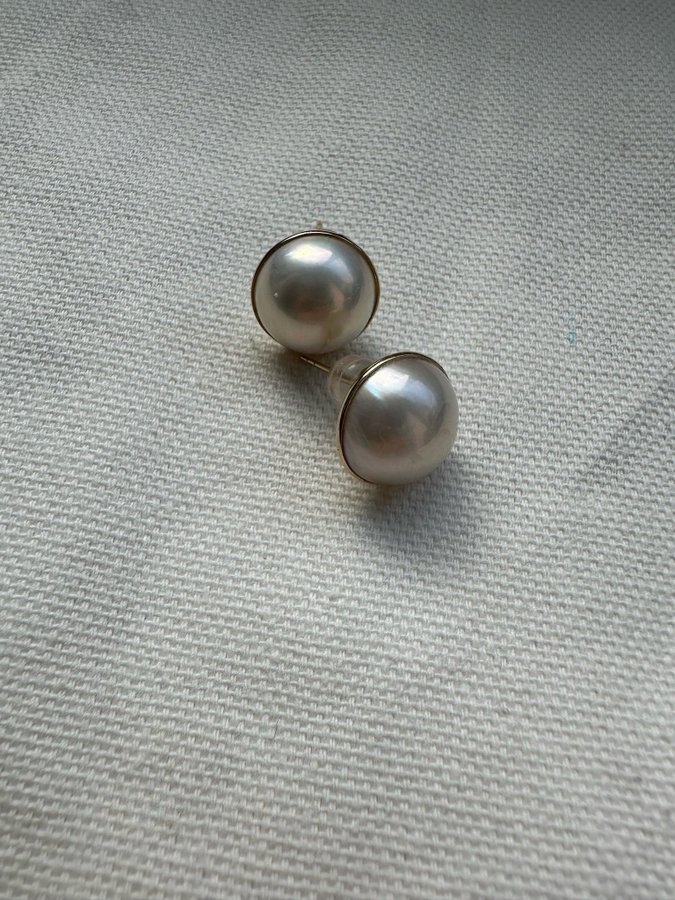 A pair of 18k gold Mabe pearl earrings