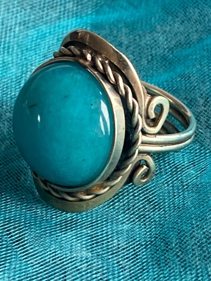 Golden ring with acqua stone