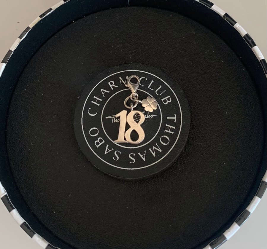 Thomas Sabo charm / berlock, siffran 18 med en fyrklöver.