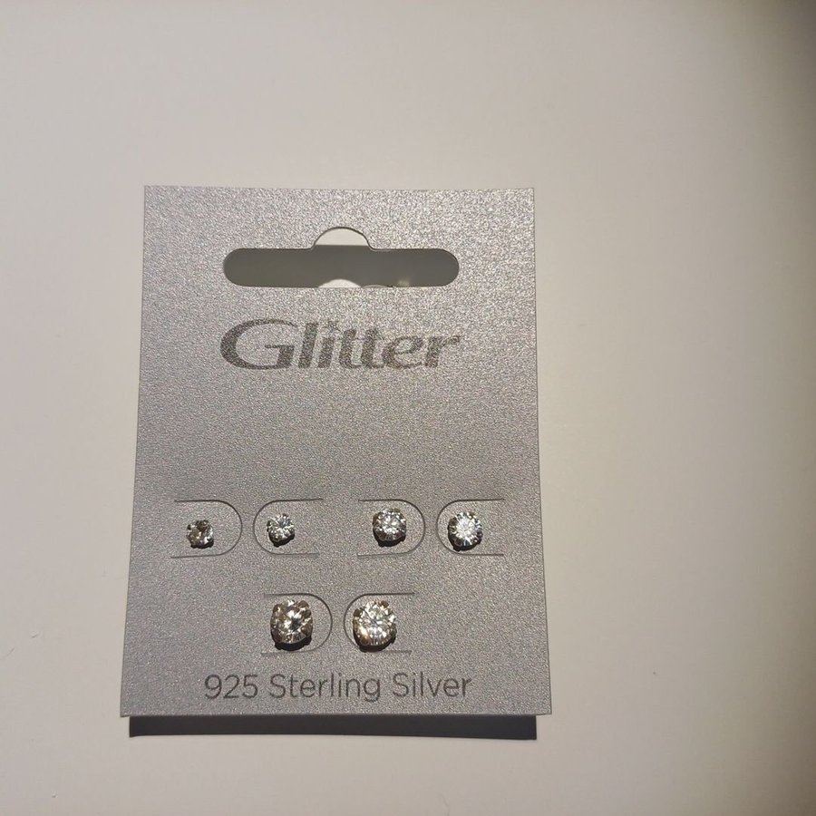 Oanvända örhängen från Glitter