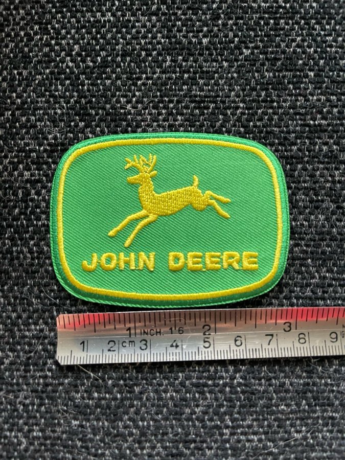 John Deere tygmärke