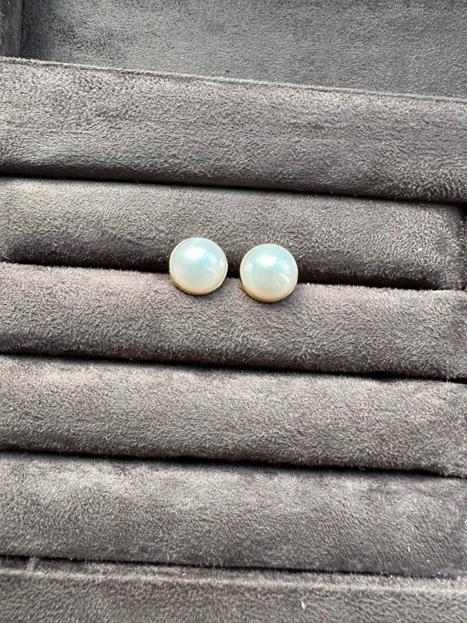 A pair of 18k gold Mabe pearl earrings