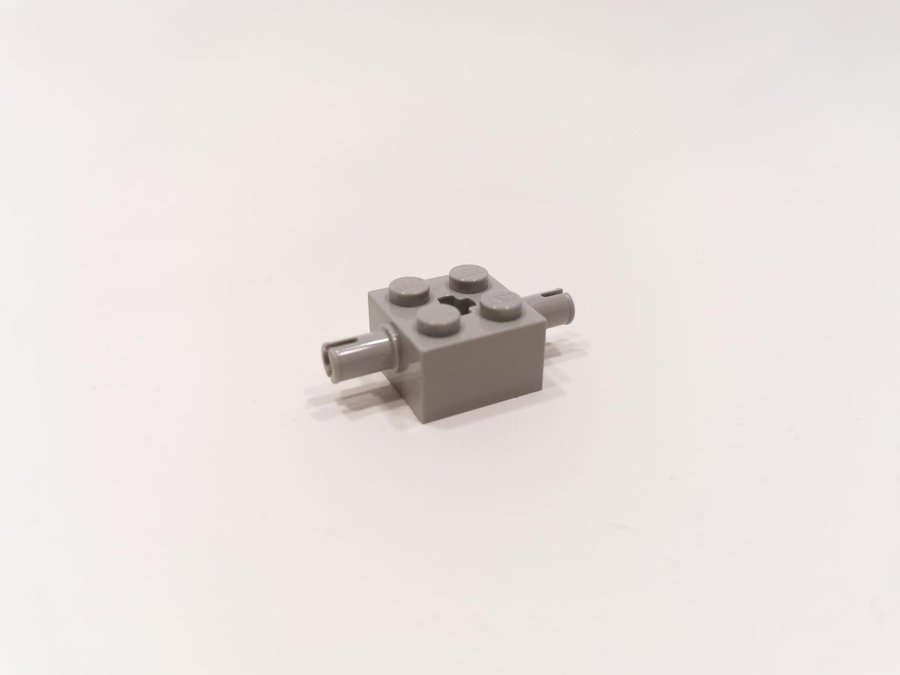 Lego - bit - 2 pin - med axelhål - 2x2 - part 3000 - ljusgrå (bluish)