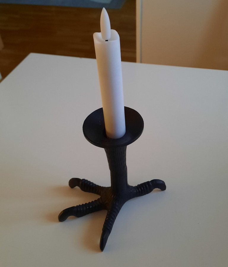 Ljusstake i fågelkloform