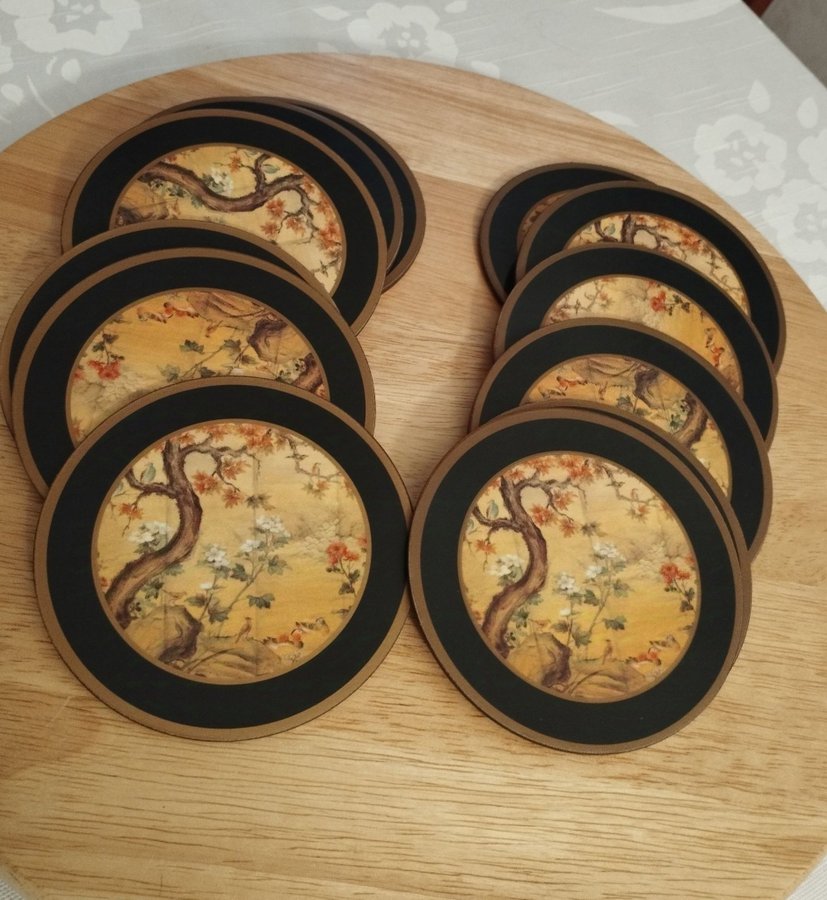 Två askar med Pimpernel De Luxe Coasters. Runda med Kinesiskt motiv.