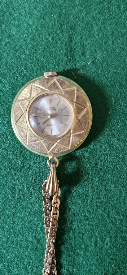 Lancel” women’s pendant watch + chain in gold plated, mechanical mechanism